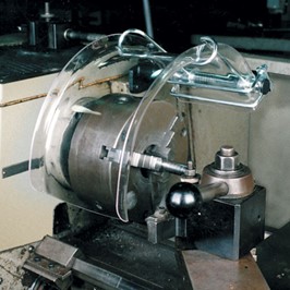 Clear Chuck Guard covering a rotating chuck.  This protects the operator from coming in contact with the chuck.