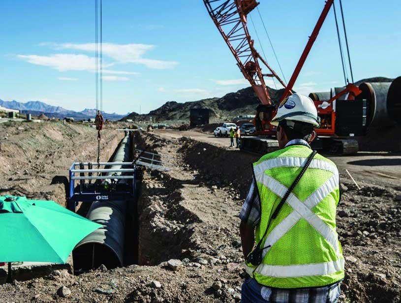 A competent person overlooking an excavation project.